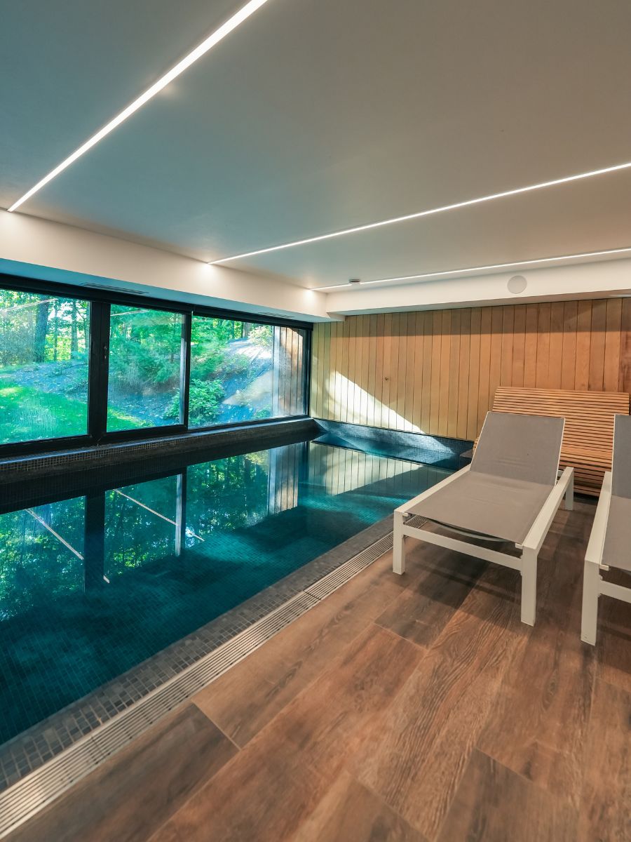 indoor swimming pool with lounge beds